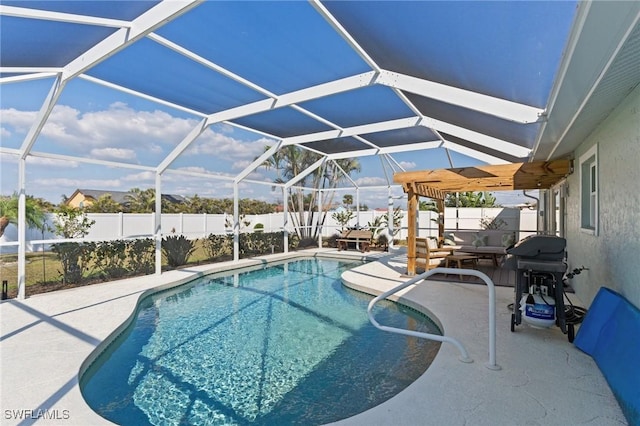view of pool with a fenced backyard, a patio, and a lanai