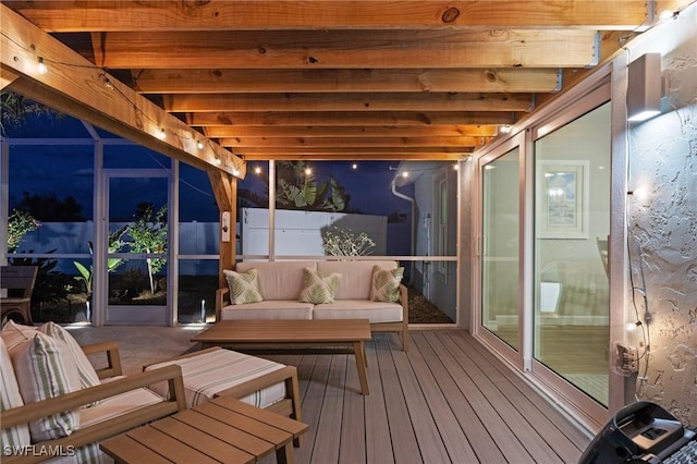 wooden terrace with an outdoor living space