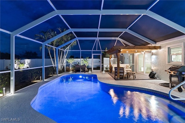 pool at twilight with a patio, grilling area, a fenced backyard, and a lanai