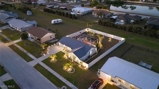 aerial view of residential area with a nearby body of water