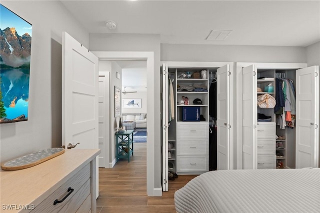 bedroom with wood finished floors