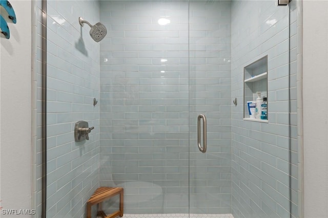 bathroom featuring a shower stall