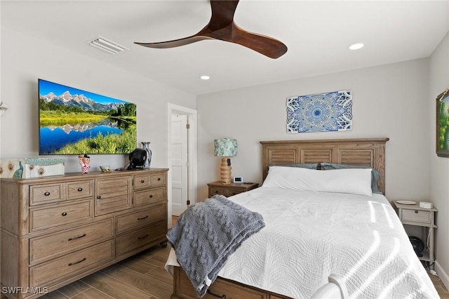 bedroom with wood finished floors, ceiling fan, and recessed lighting