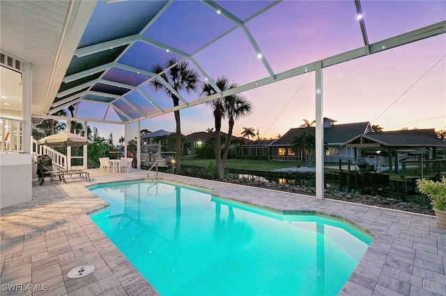 27150 Mora Rd, Bonita Springs, FL 34135 - outdoor pool with a patio and glass enclosure