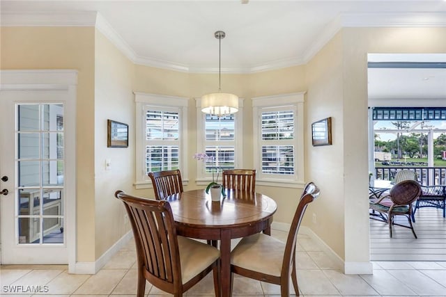 27150 Mora Rd, Bonita Springs, FL 34135 - dining area featuring light tile patterned floors, a chandelier, ornamental molding, and baseboards