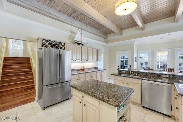 27150 Mora Rd, Bonita Springs, FL 34135 - kitchen with appliances with stainless steel finishes, a sink, light tile patterned flooring, cream cabinets, and wooden ceiling with exposed beams