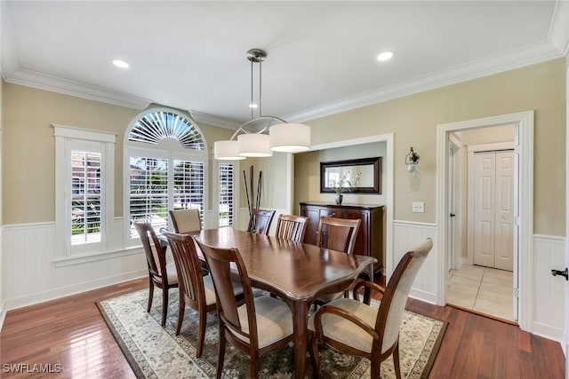 27150 Mora Rd, Bonita Springs, FL 34135 - dining area featuring a wainscoted wall, wood finished floors, ornamental molding, and recessed lighting