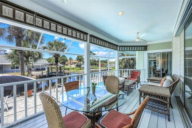 27150 Mora Rd, Bonita Springs, FL 34135 - sunroom with a ceiling fan, outdoor dining space, and a water view