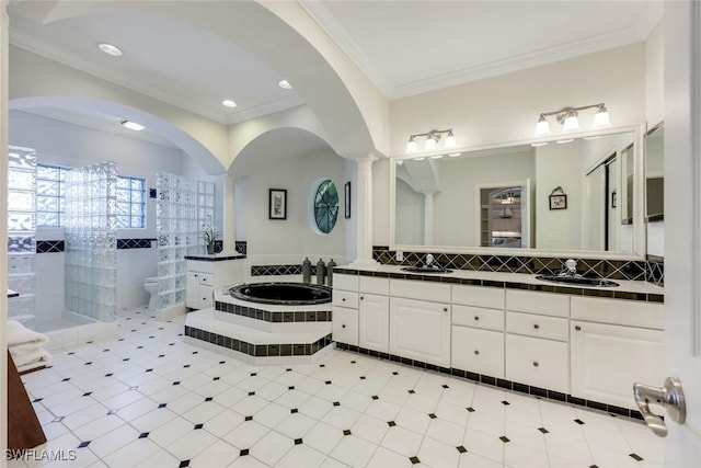 27150 Mora Rd, Bonita Springs, FL 34135 - full bath featuring ornate columns, toilet, a bath, ornamental molding, and vanity