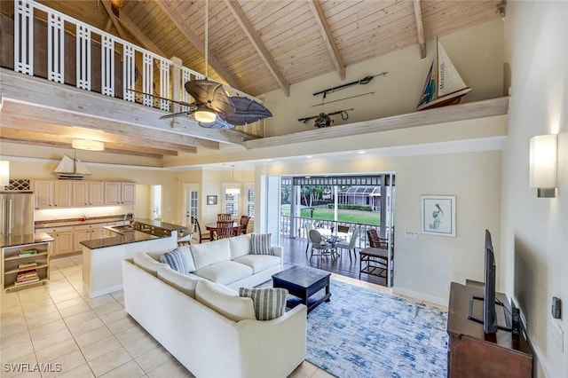 27150 Mora Rd, Bonita Springs, FL 34135 - living area featuring light tile patterned floors, high vaulted ceiling, wood ceiling with exposed beams, and ceiling fan