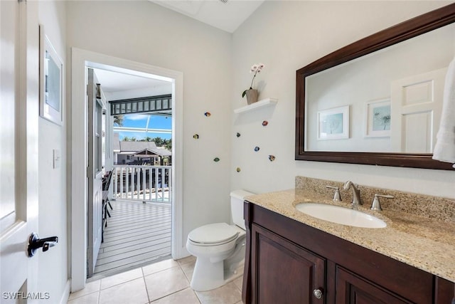 27150 Mora Rd, Bonita Springs, FL 34135 - bathroom featuring vanity, tile patterned flooring, and toilet