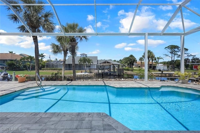 27150 Mora Rd, Bonita Springs, FL 34135 - swimming pool featuring a lanai, a residential view, a water view, and a patio area