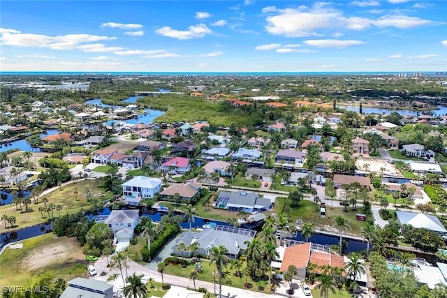 27150 Mora Rd, Bonita Springs, FL 34135 - aerial overview of property's location with a nearby body of water and nearby suburban area