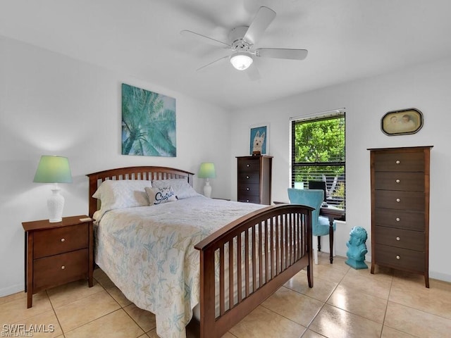bedroom featuring light tile patterned flooring, ceiling fan, and baseboards