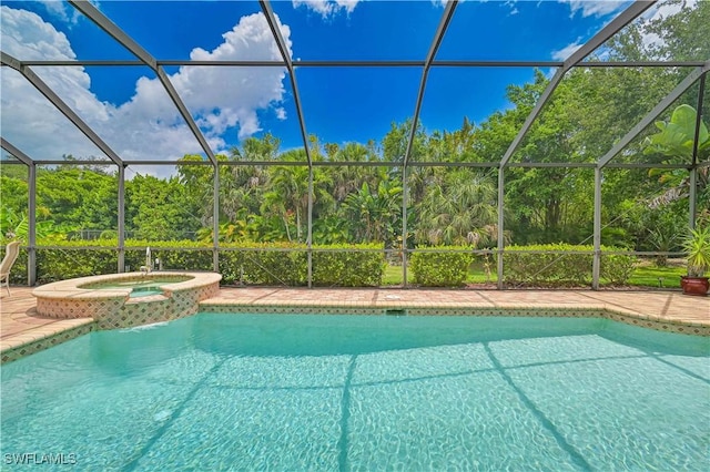 7810 Twin Eagle Ln, Fort Myers, FL 33912 - view of swimming pool with glass enclosure, a patio, and a pool with connected hot tub