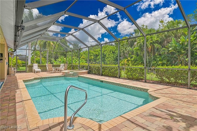 7810 Twin Eagle Ln, Fort Myers, FL 33912 - view of pool with a patio area, a lanai, and a pool with connected hot tub