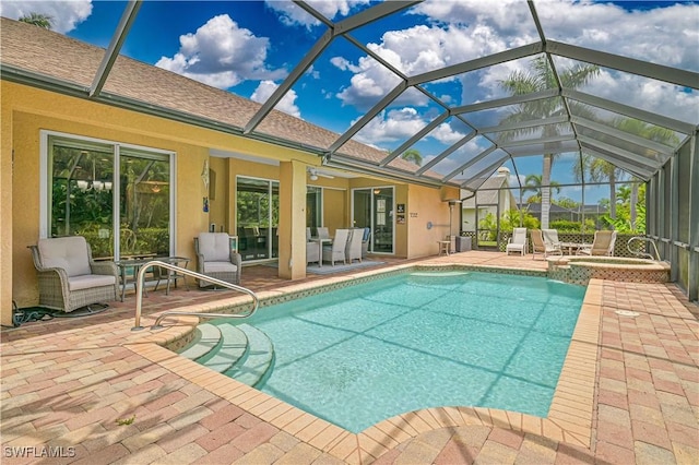 7810 Twin Eagle Ln, Fort Myers, FL 33912 - view of swimming pool featuring a patio, a pool with connected hot tub, and a lanai