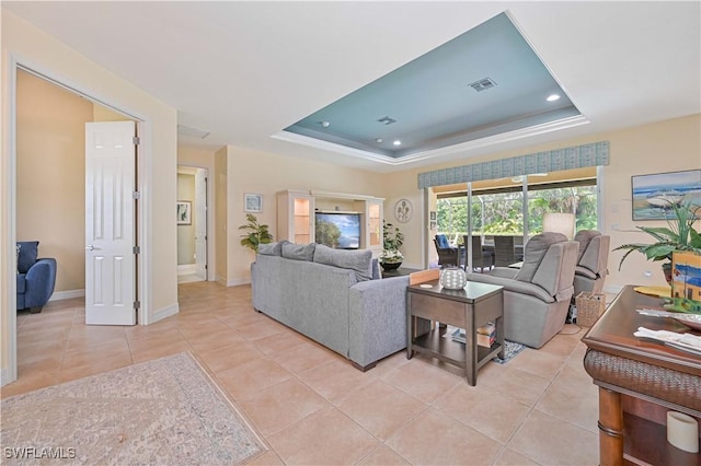 7810 Twin Eagle Ln, Fort Myers, FL 33912 - living room featuring a raised ceiling, light tile patterned floors, recessed lighting, and baseboards