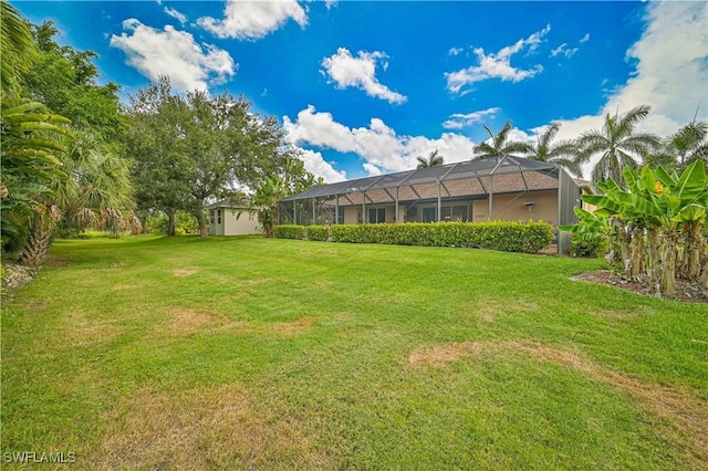 7810 Twin Eagle Ln, Fort Myers, FL 33912 - view of green lawn with a lanai