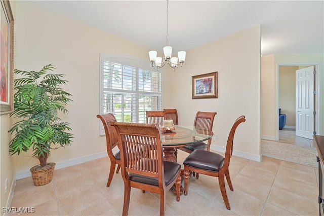 7810 Twin Eagle Ln, Fort Myers, FL 33912 - dining room with a chandelier, light tile patterned floors, and baseboards