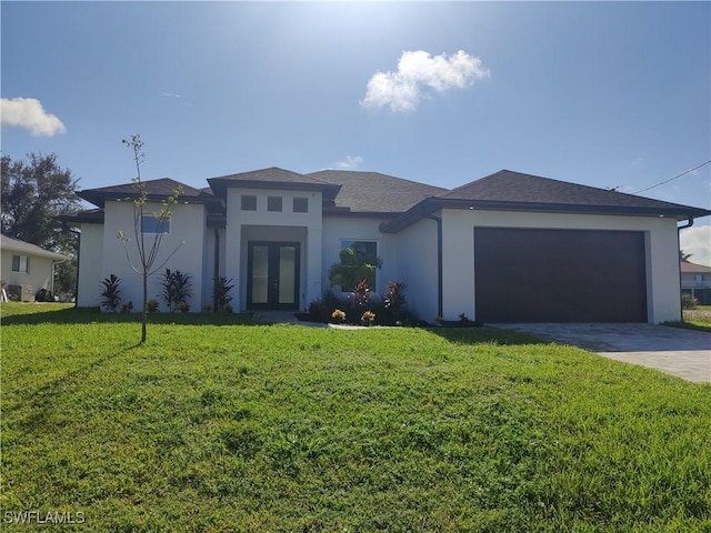 3607 SW 8th Ct, Cape Coral, FL 33914 - prairie-style house featuring french doors, stucco siding, a garage, a front yard, and driveway