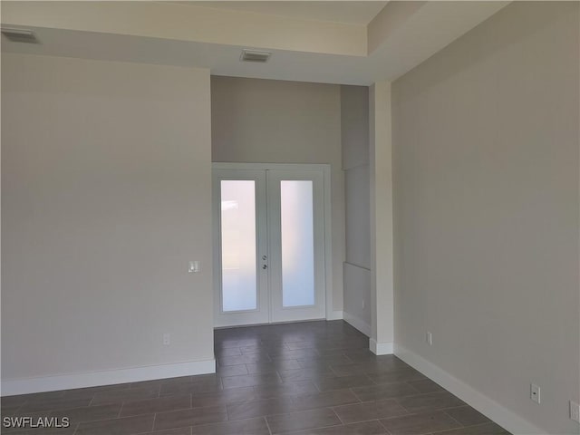 3607 SW 8th Ct, Cape Coral, FL 33914 - spare room with french doors and baseboards
