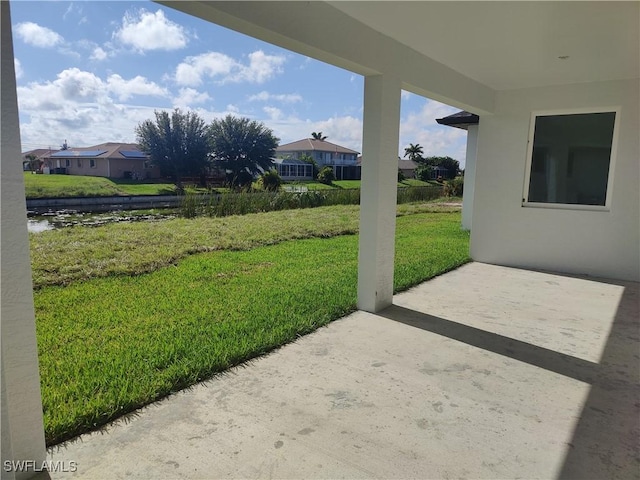 3607 SW 8th Ct, Cape Coral, FL 33914 - view of green lawn with a patio area, a residential view, and a water view