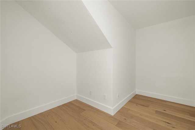 4485 Dover Ct Unit 1202, Naples, FL 34105 - additional living space with light wood finished floors, baseboards, and lofted ceiling
