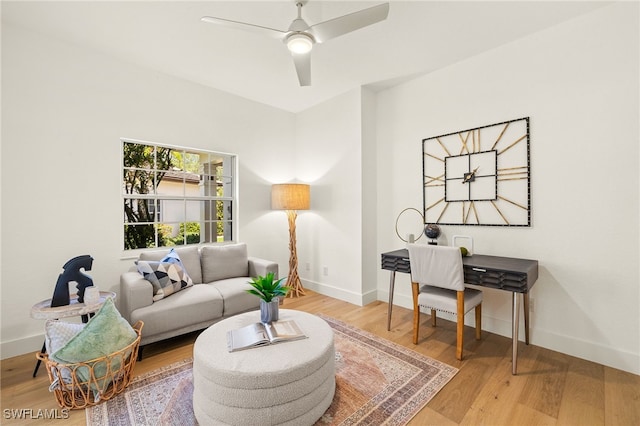4485 Dover Ct Unit 1202, Naples, FL 34105 - living area with a ceiling fan, wood finished floors, and baseboards