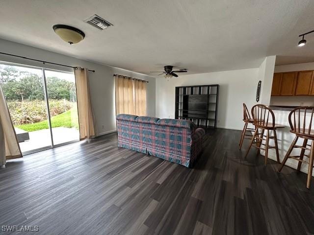 6370 Brant Bay Blvd Unit 105, North Fort Myers, FL 33917 - living room with ceiling fan and dark wood-style flooring