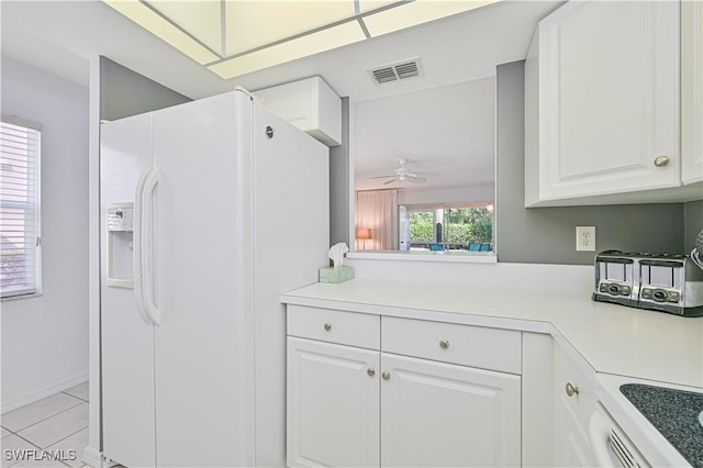 26735 Little John Ct Unit 25, Bonita Springs, FL 34135 - kitchen featuring white refrigerator with ice dispenser, a ceiling fan, light countertops, light tile patterned floors, and white cabinetry