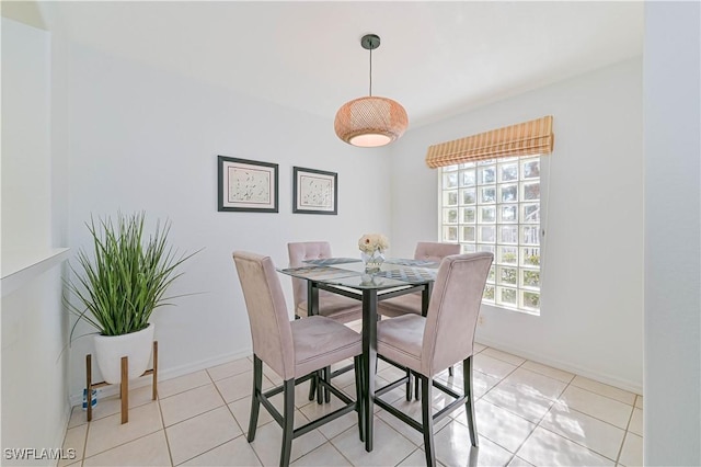 26735 Little John Ct Unit 25, Bonita Springs, FL 34135 - dining room with light tile patterned flooring and baseboards