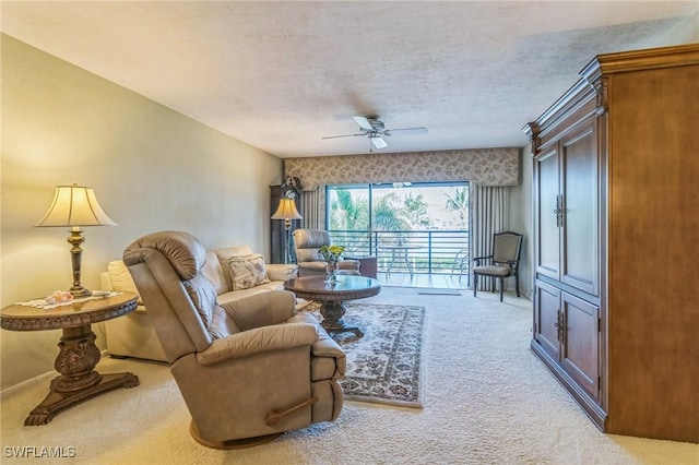 226 3rd St Unit 208, Bonita Springs, FL 34134 - carpeted living room featuring ceiling fan and a textured ceiling