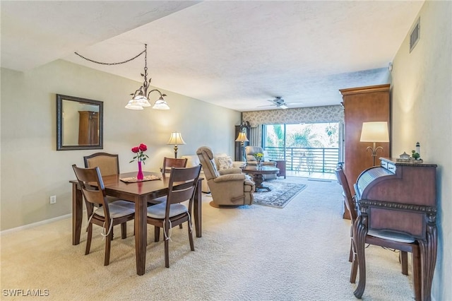226 3rd St Unit 208, Bonita Springs, FL 34134 - dining space with light carpet, ceiling fan, a chandelier, and baseboards