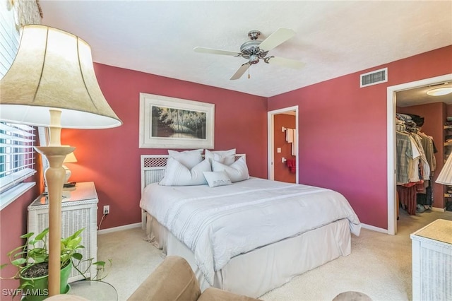 226 3rd St Unit 208, Bonita Springs, FL 34134 - carpeted bedroom featuring a walk in closet, baseboards, ceiling fan, and a closet