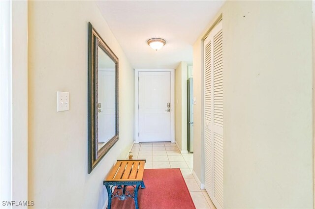 226 3rd St Unit 208, Bonita Springs, FL 34134 - corridor with light tile patterned floors and baseboards