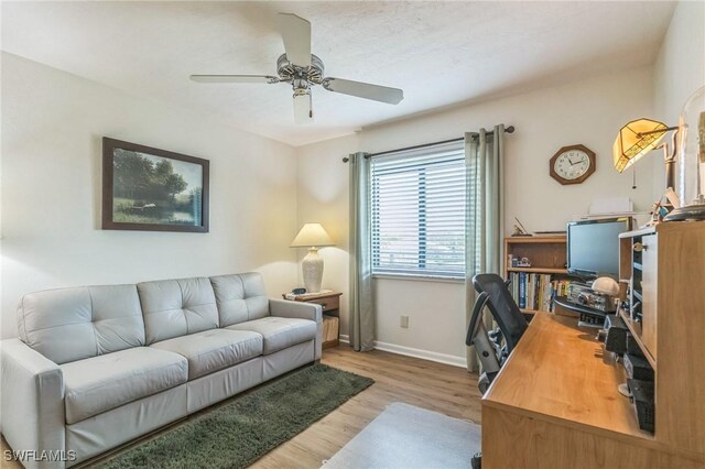 226 3rd St Unit 208, Bonita Springs, FL 34134 - home office with wood finished floors, ceiling fan, and baseboards