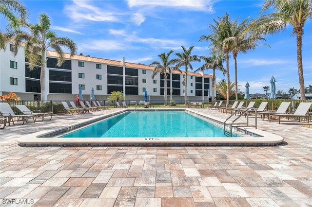 226 3rd St Unit 208, Bonita Springs, FL 34134 - community pool featuring a patio and fence