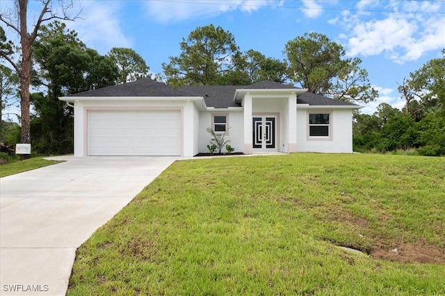 2916 15th St W, Lehigh Acres, FL 33971 - view of front of house with a garage, french doors, driveway, stucco siding, and a front yard