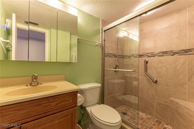 3460 N Key Dr Unit 210, North Fort Myers, FL 33903 - bathroom with a stall shower, toilet, and vanity