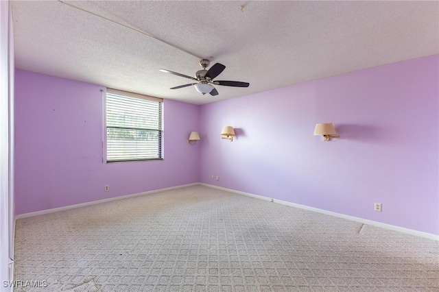 3460 N Key Dr Unit 210, North Fort Myers, FL 33903 - carpeted empty room with a ceiling fan, baseboards, and a textured ceiling