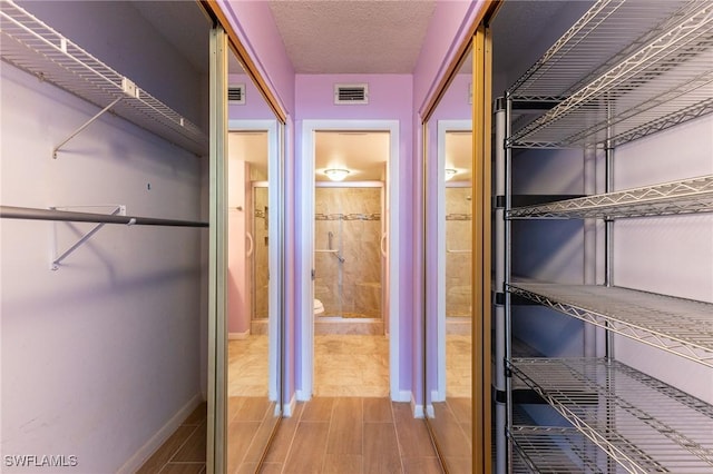 3460 N Key Dr Unit 210, North Fort Myers, FL 33903 - spacious closet featuring wood finish floors
