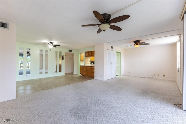 3460 N Key Dr Unit 210, North Fort Myers, FL 33903 - unfurnished living room with ceiling fan and baseboards