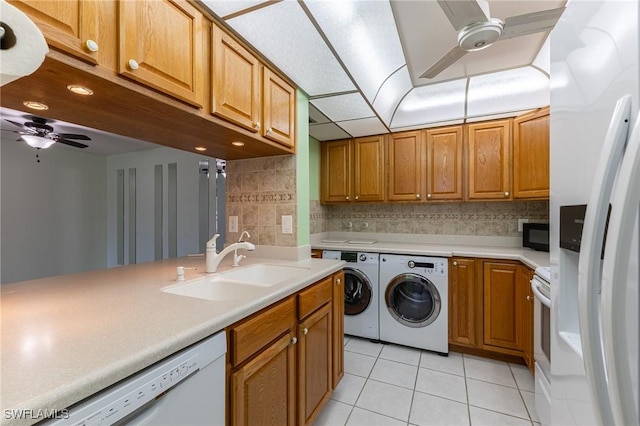3460 N Key Dr Unit 210, North Fort Myers, FL 33903 - clothes washing area featuring a ceiling fan, washing machine and clothes dryer, light tile patterned flooring, and recessed lighting