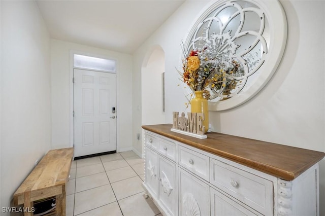 1713 NW 9th Ter, Cape Coral, FL 33993 - entryway featuring arched walkways and light tile patterned flooring