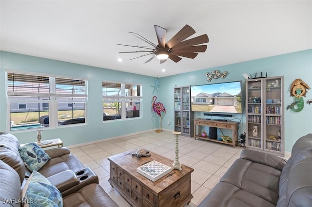 1713 NW 9th Ter, Cape Coral, FL 33993 - tiled living area featuring ceiling fan and baseboards