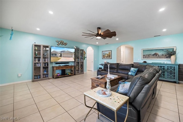 1713 NW 9th Ter, Cape Coral, FL 33993 - tiled living area with arched walkways, ceiling fan, and recessed lighting