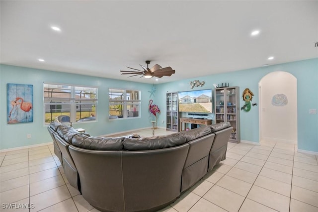 1713 NW 9th Ter, Cape Coral, FL 33993 - living area featuring arched walkways, a ceiling fan, recessed lighting, and light tile patterned floors