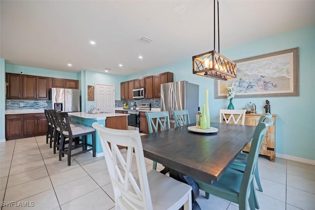1713 NW 9th Ter, Cape Coral, FL 33993 - dining room with light tile patterned floors and recessed lighting