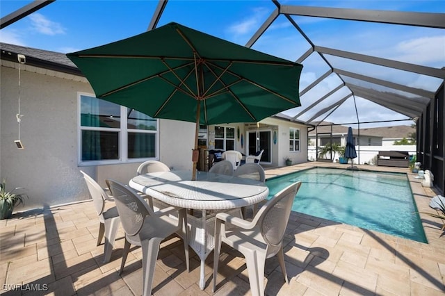 1713 NW 9th Ter, Cape Coral, FL 33993 - swimming pool with a patio area, outdoor dining area, and glass enclosure